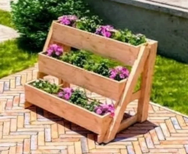 Three-tier wooden flower planter on a brick patio
